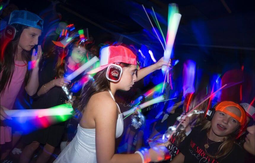 High energy silent disco with glow sticks at a Bat Mitzvah.