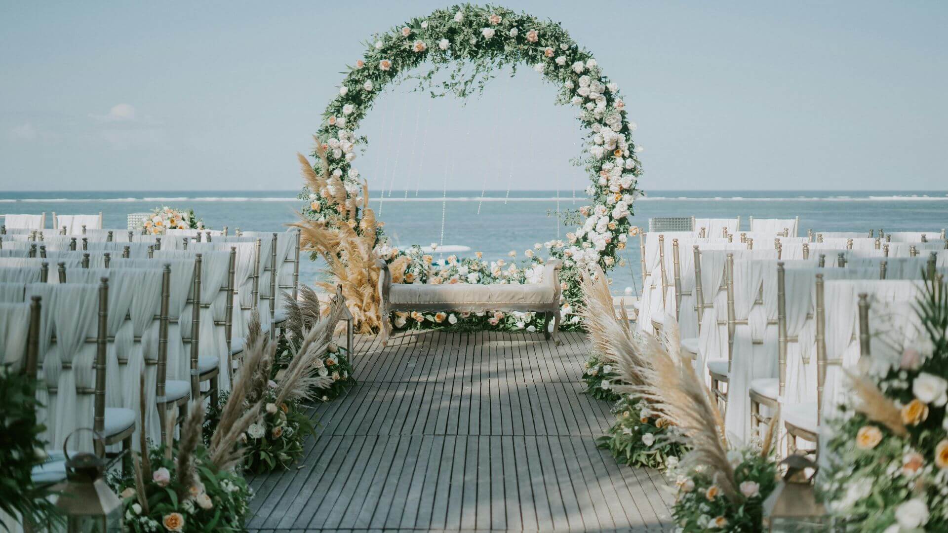 An elegant micro wedding by the the ocean with upscale decor.
