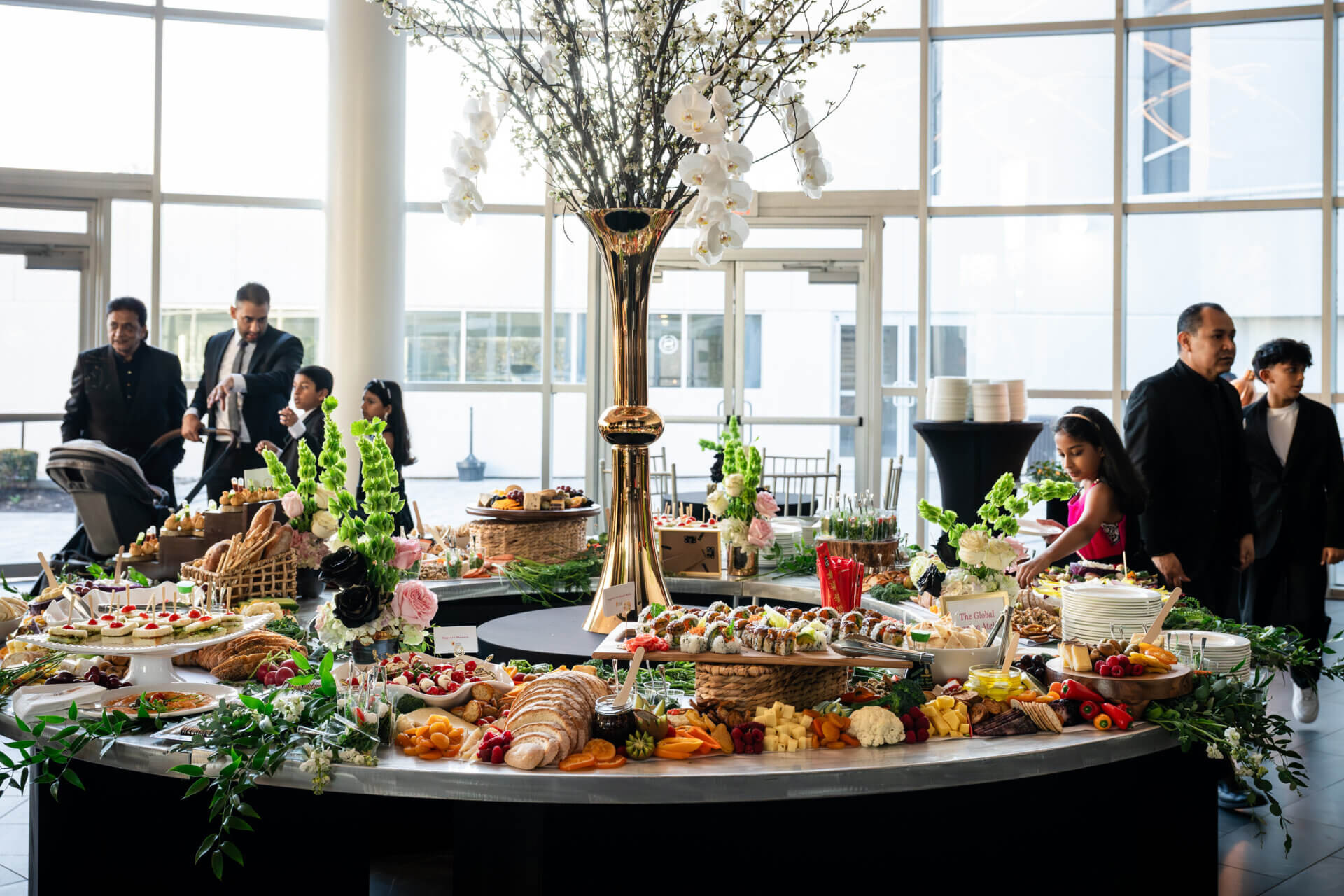 A beautiful display of food at a sweet 16 birthday party